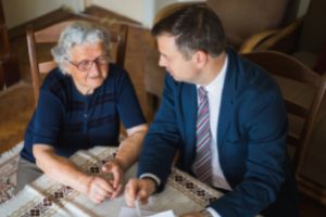 Adviser supporting grieving lady