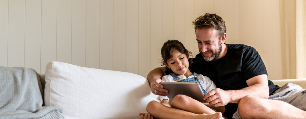 Dad and daughter on iPad