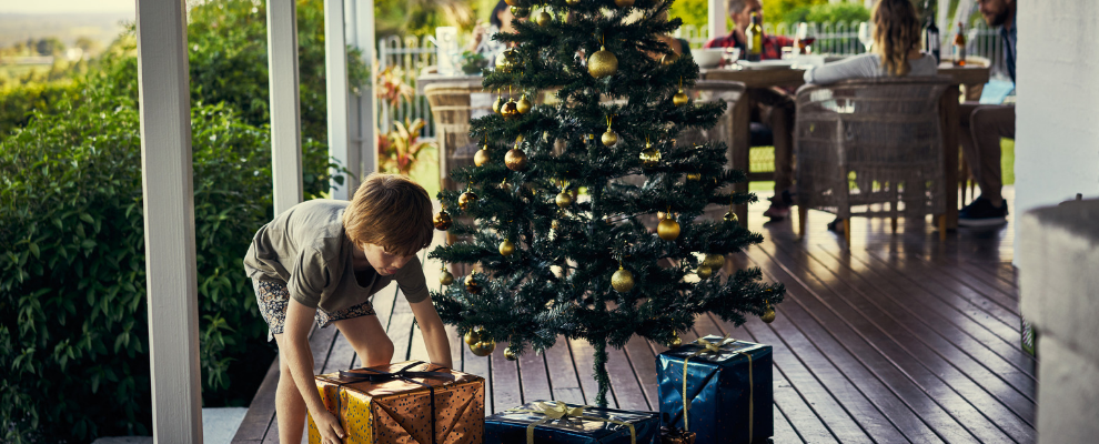 child opening christmas presents