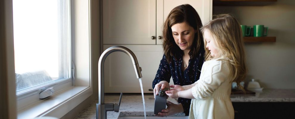 Mum and daughter washing hands