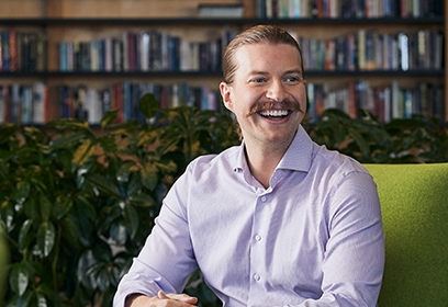 Smiling man in library