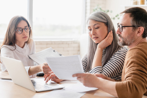 Adviser talking with clients in office